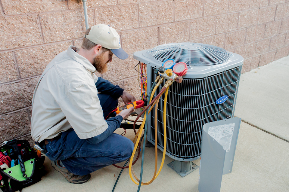 HVAC-Technician cooling unit serviced by Affordable Comfort Heating and Cooling