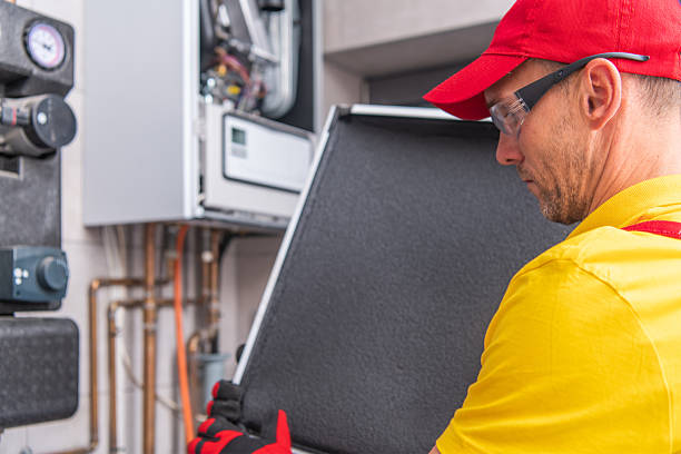 istockphoto-2242863927-612x612 Affordable Comfort Heating and Cooling technician inspecting home HVAC equipment