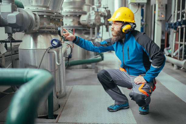 Technician inspecting central heating system in Detroit MI
