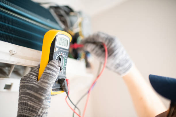 HVAC professional servicing residential furnace in Grosse Pointe Shores