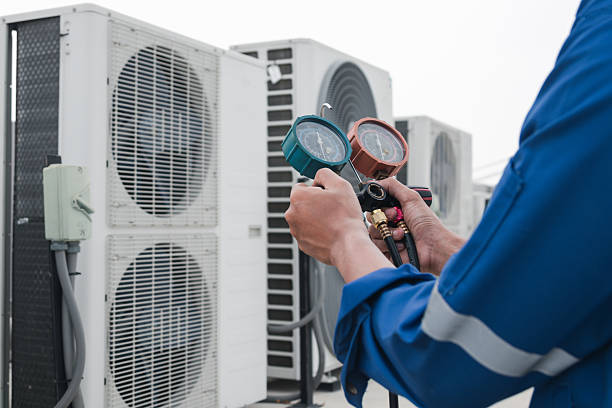 HVAC professional servicing residential furnace in Grosse Pointe Shores
