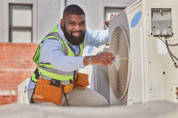 AC repair technician servicing residential air conditioning system in Detroit Michigan